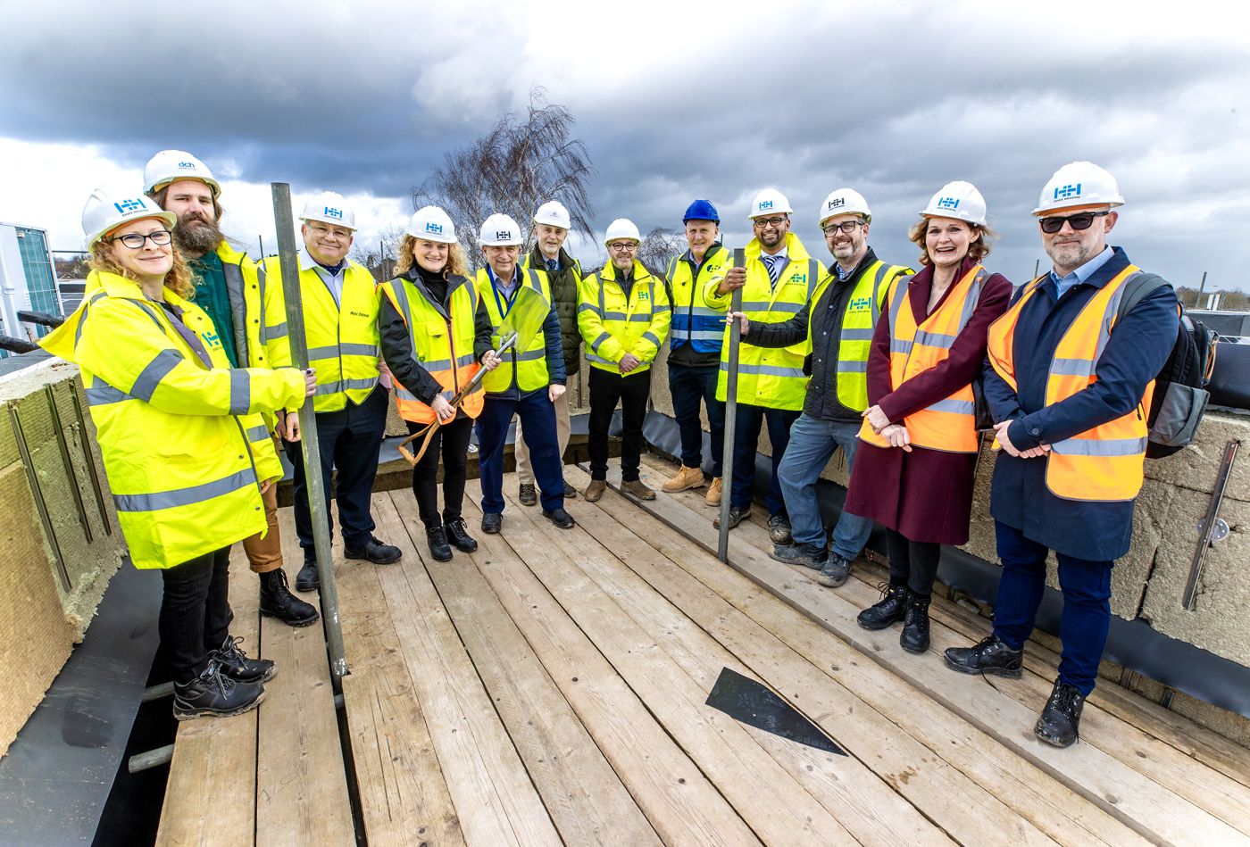 The project team in hard hats and hi-vis at the Shenfield Library topping out ceremony